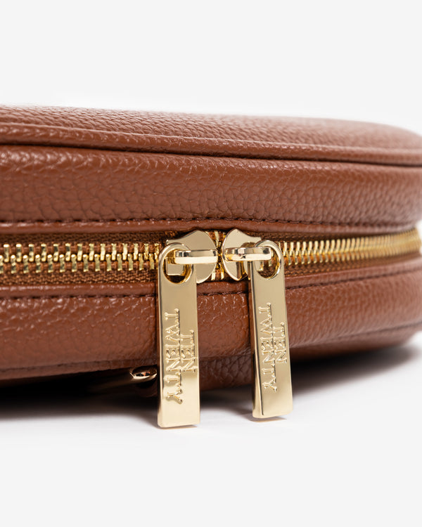 Gold precision zip detail on Ten Twenty Arabica Coffee padel racket bag in tan brown vegan leather
