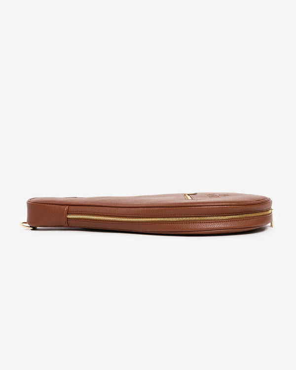 Side profile of Ten Twenty Arabica Coffee padel racket bag showing structured form and gold zip in tan brown vegan leather