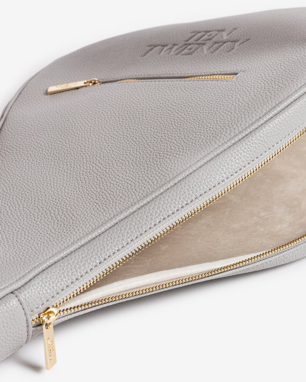Interior suede lining and open zip detail on Ten Twenty Dubai Skyline padel racket bag in light grey vegan leather