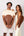 Man and woman holding Ten Twenty Arabica Coffee padel racket bags in tan brown vegan leather - Ten Twenty UAE