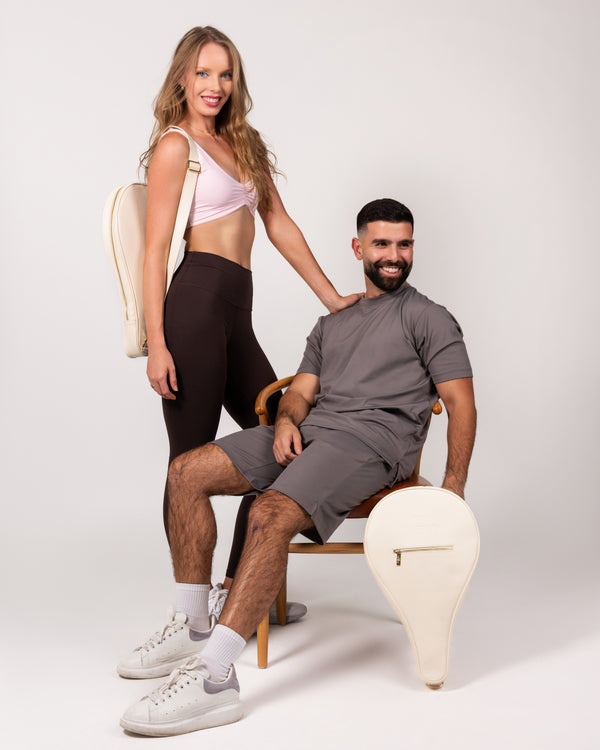 Man and woman with Ten Twenty Jumeirah Pearls padel racket bag in cream vegan leather - lifestyle shot UAE