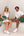 Man and woman with Ten Twenty Emirates Palms padel bags in forest green - lifestyle shot Dubai